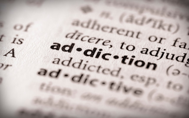 Selective focus on the word "addiction".